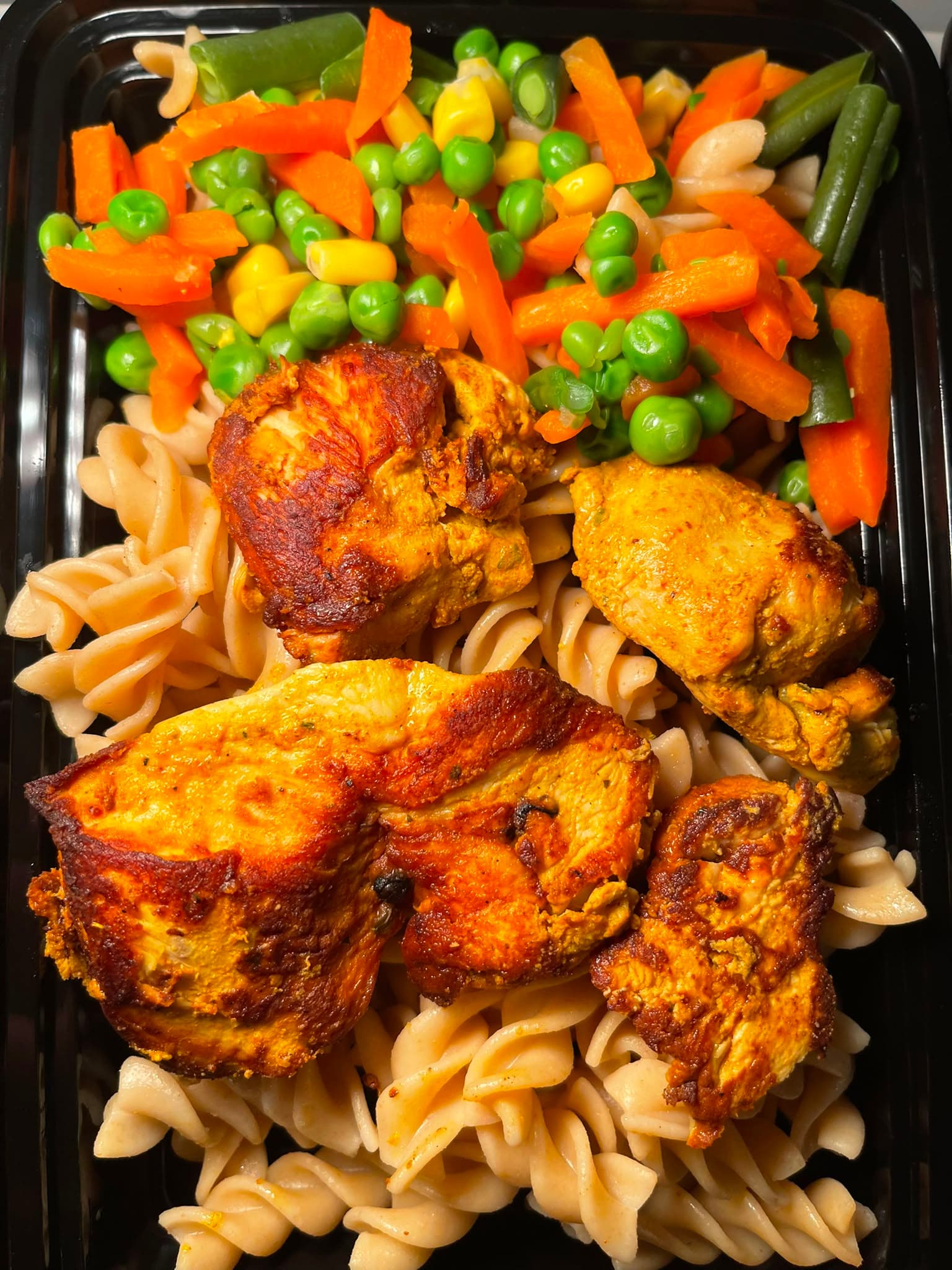 Chicken & Whole Wheat Pasta, packed and ready for delivery